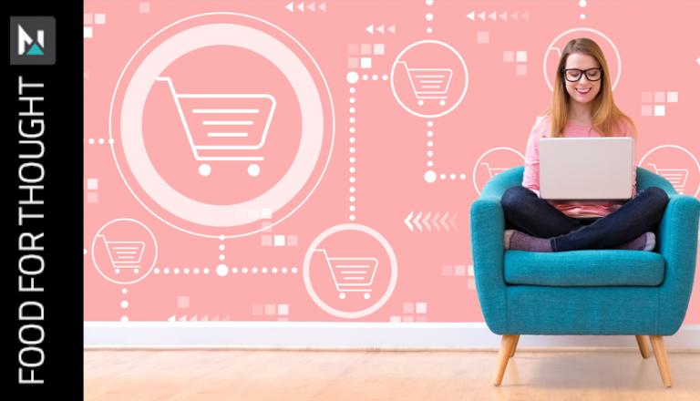 woman sitting on teal chair doing some digital shopping